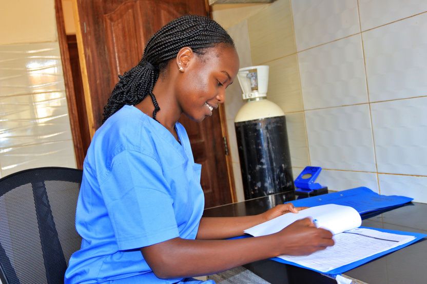 A nurse updating patient records